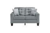 Close-up detail of tufting on loveseat seating