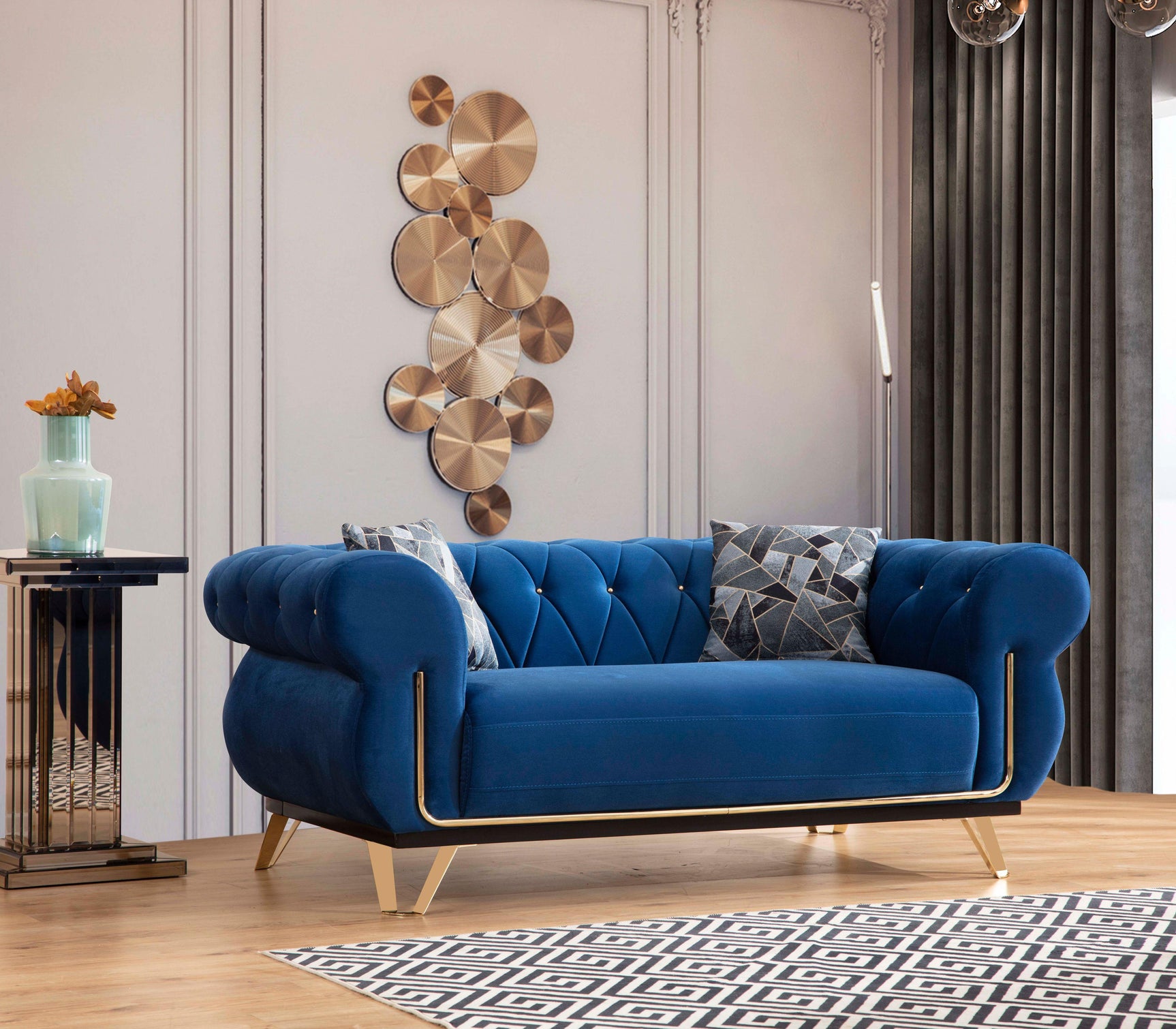 Detail view of tufted backrest on navy velvet sofa
