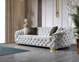 Close-up of sofa armrest with ivory velvet fabric