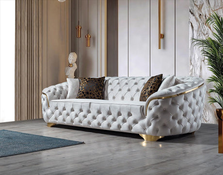 Close-up of sofa armrest with ivory velvet fabric