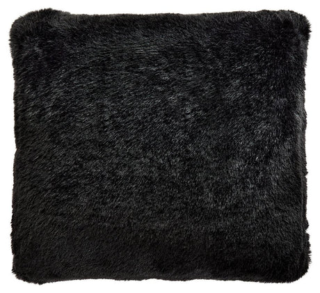 Side angle of Gariland Black Pillow showing plush faux fur face