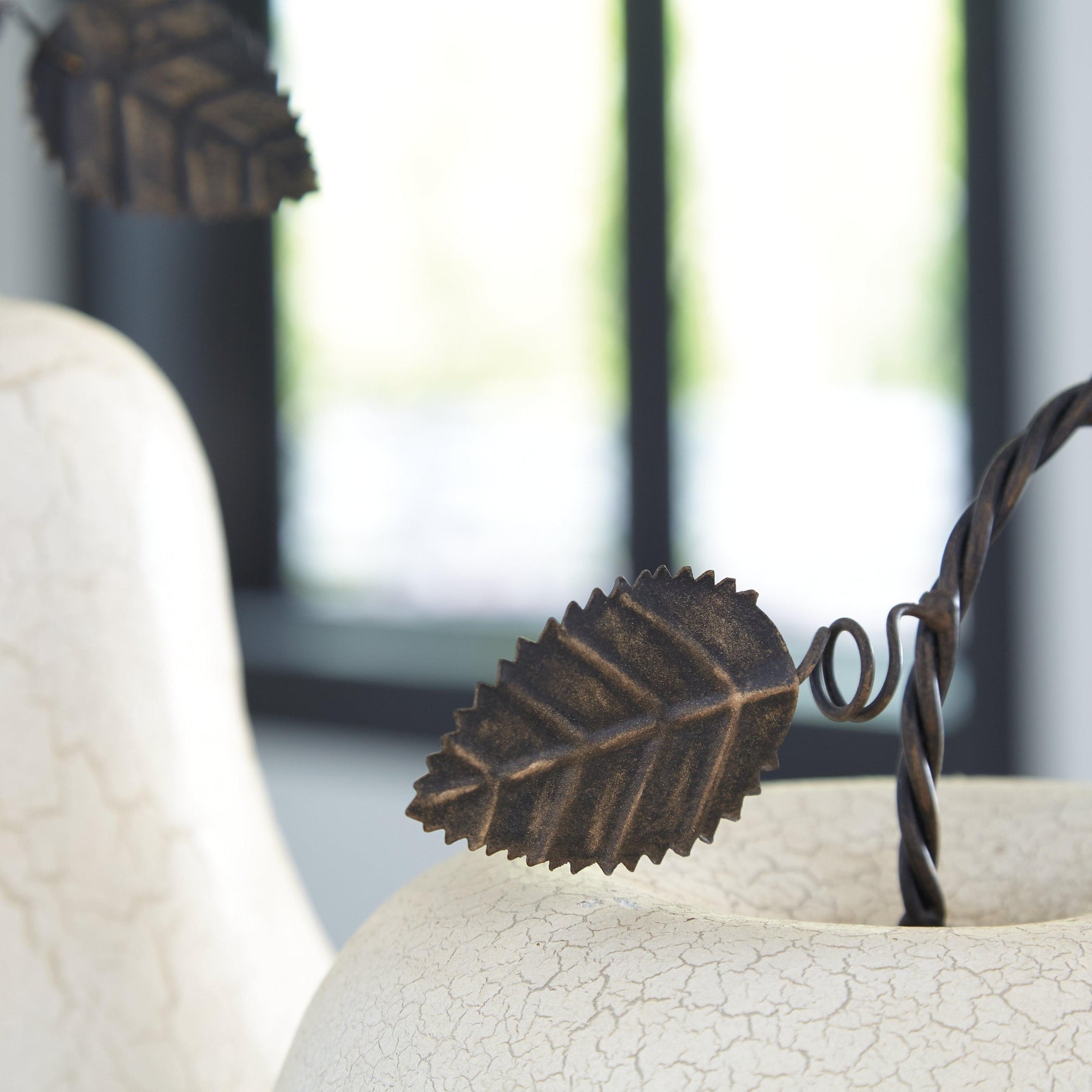 Close-up of Bidelia Sculpture surface texture and antiqued white crackle finish