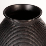 Close-up of antiqued brown finish on Hannela Vase