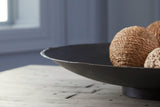 Detail of antiqued brown metal finish on Moises Bowl