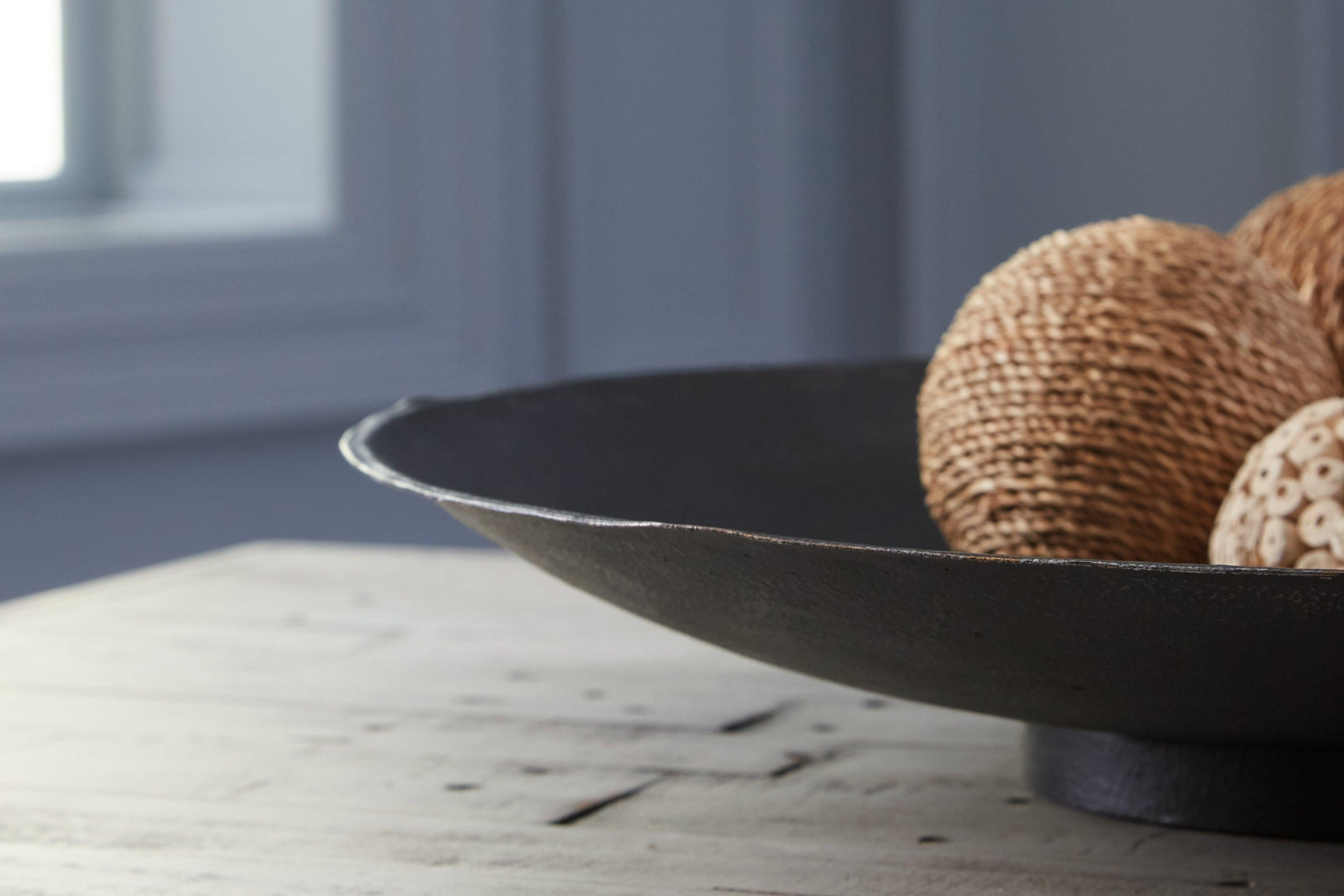 Detail of antiqued brown metal finish on Moises Bowl
