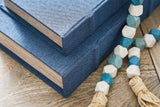 Jolina Blue Box Set stacked on coffee table