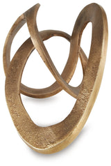 Close-up detail of textured antique brass finish on Dunnruck sculpture