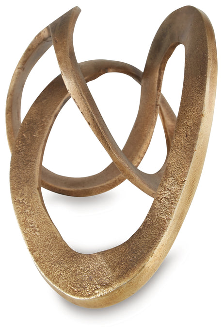 Close-up detail of textured antique brass finish on Dunnruck sculpture