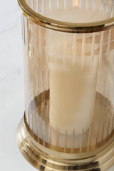 Amber glass and metal candle holder angled view