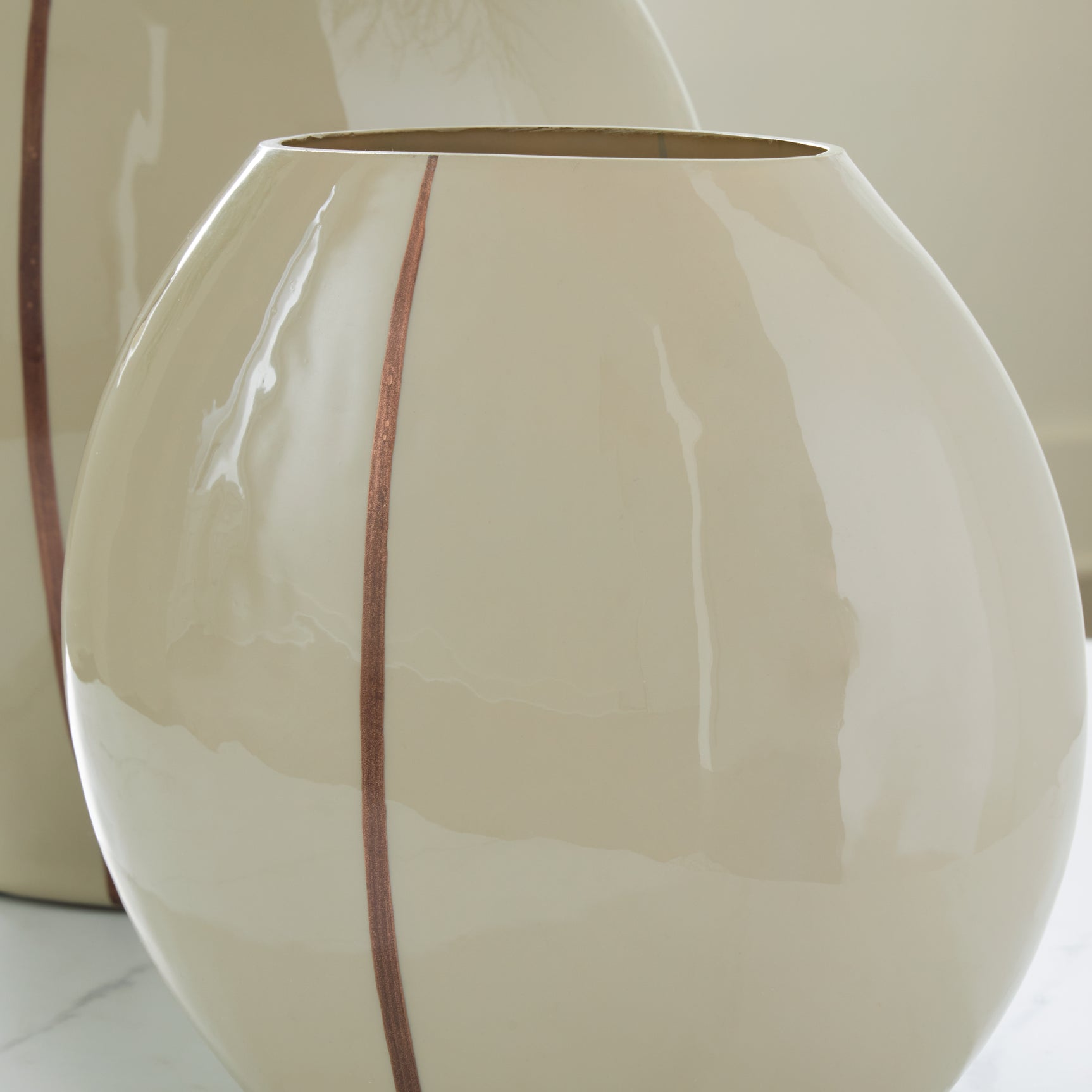 Detail of copper-tone hand-painted accent