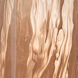 Close-up of flowing swirl pattern on blush pink vase