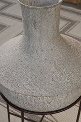 Espresso brown metal stand supporting the Estonbank Vase