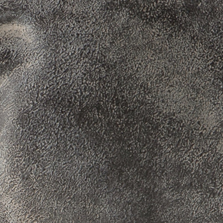 Close-up of the antiqued black finish and texture on Carnlow sculpture