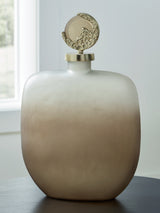 Close-up of Acario Jar goldtone cast aluminum topper texture