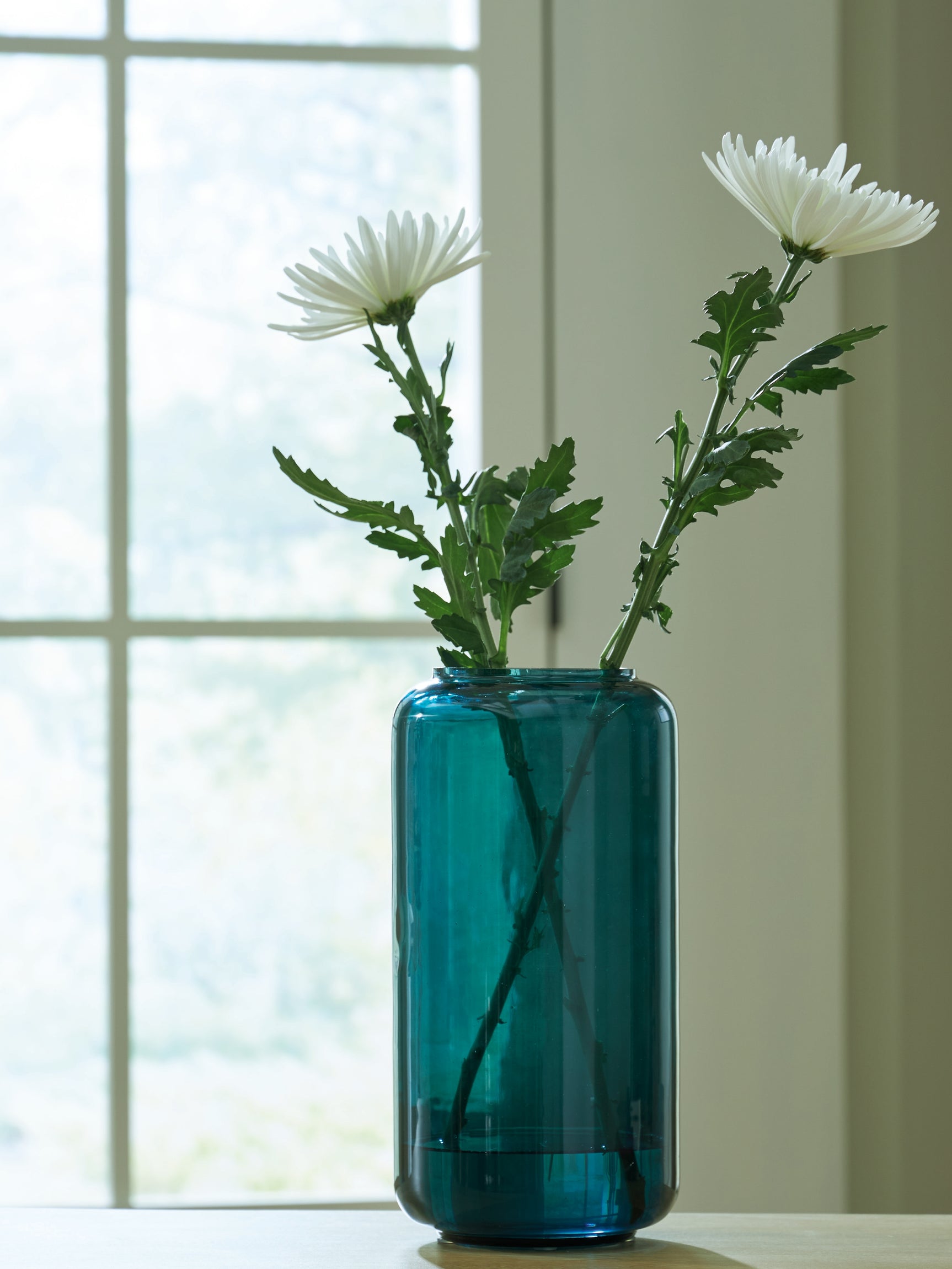 Inisland vase styled with flowers on wood table