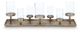 Close-up of Wallmond candle holder detail with clear glass and brass finish