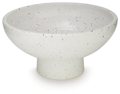 Close-up detail of black speckles on white glazed terra cotta bowl