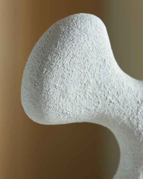 Detail view of base and sculpture connection