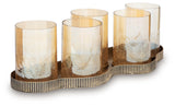 Close-up detail of pale amber glass votive on antique gold metal arm
