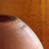 Side angle of Embersen Amber Glass Vase showing shape and finish