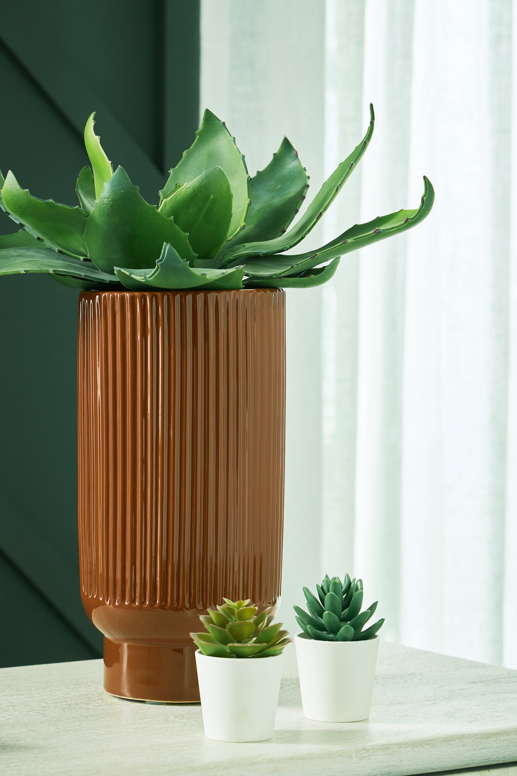 Two Avalyah vases displayed with flowers