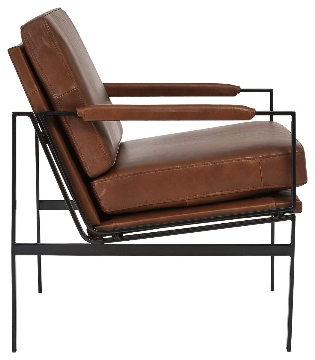 Puckman accent chair side profile with metal frame and leather upholstery