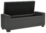 Open hinged seat revealing storage compartment