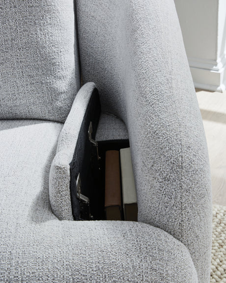 Detail close-up of storage compartments inside arm bolster