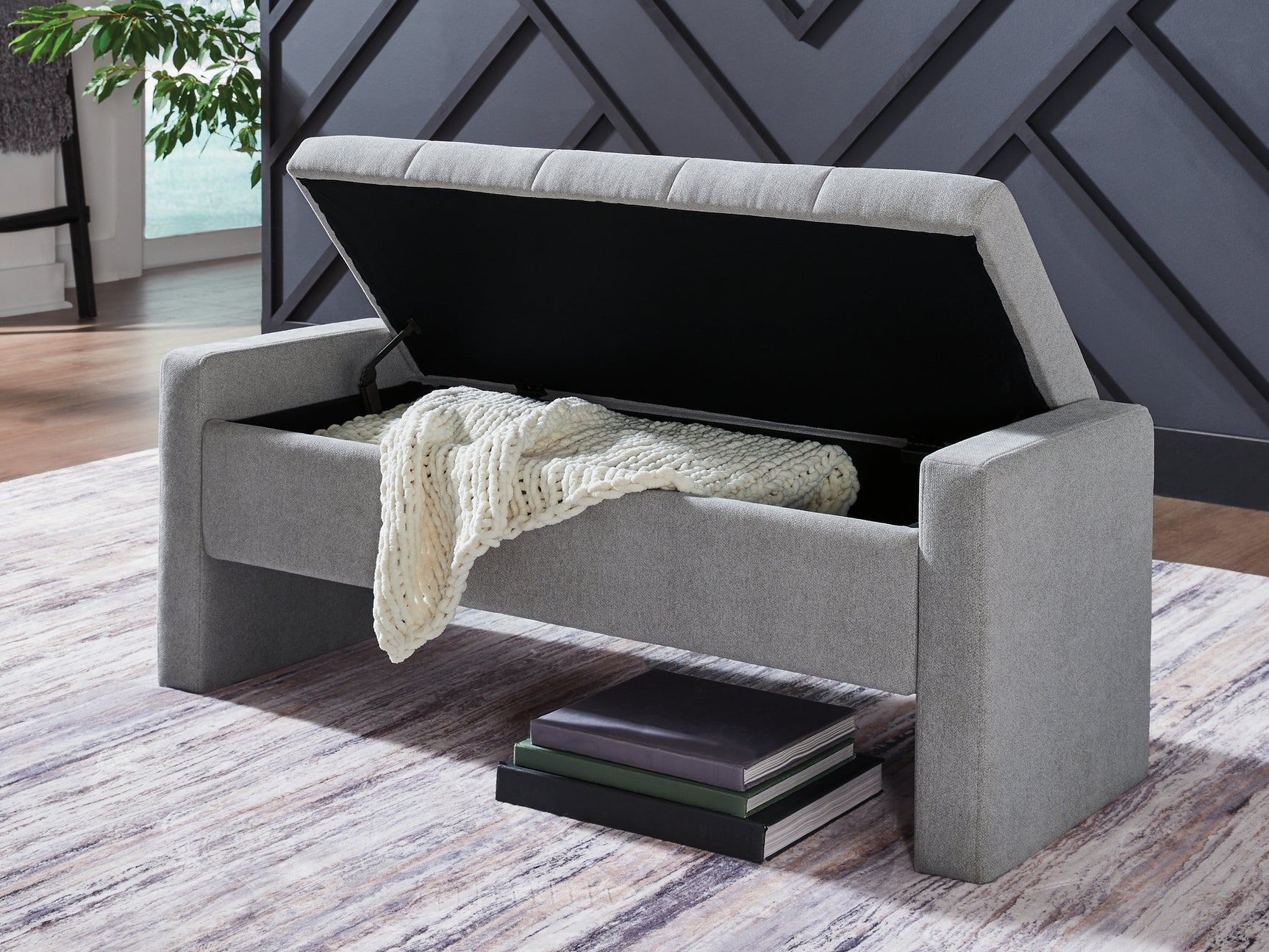 Open storage compartment of Akselman Gray Storage Bench