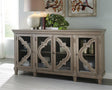 Fossil Ridge Gray Accent Cabinet front view showing quatrefoil glass doors