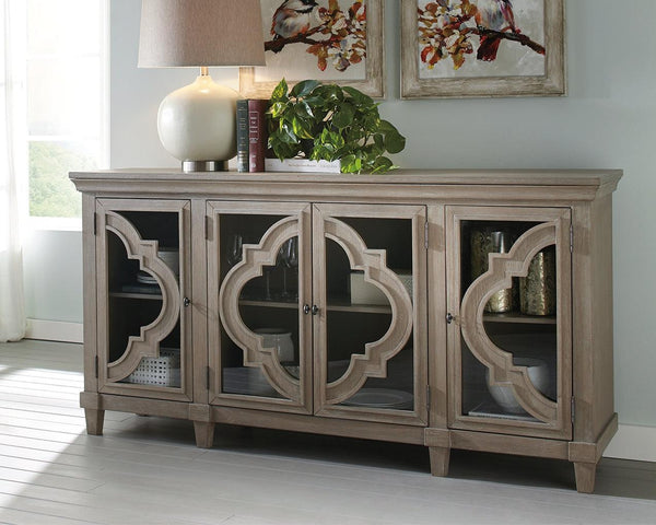 Fossil Ridge Gray Accent Cabinet front view showing quatrefoil glass doors