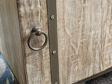 Close-up of Laddford Accent Cabinet antiqued brown hardware and wood texture