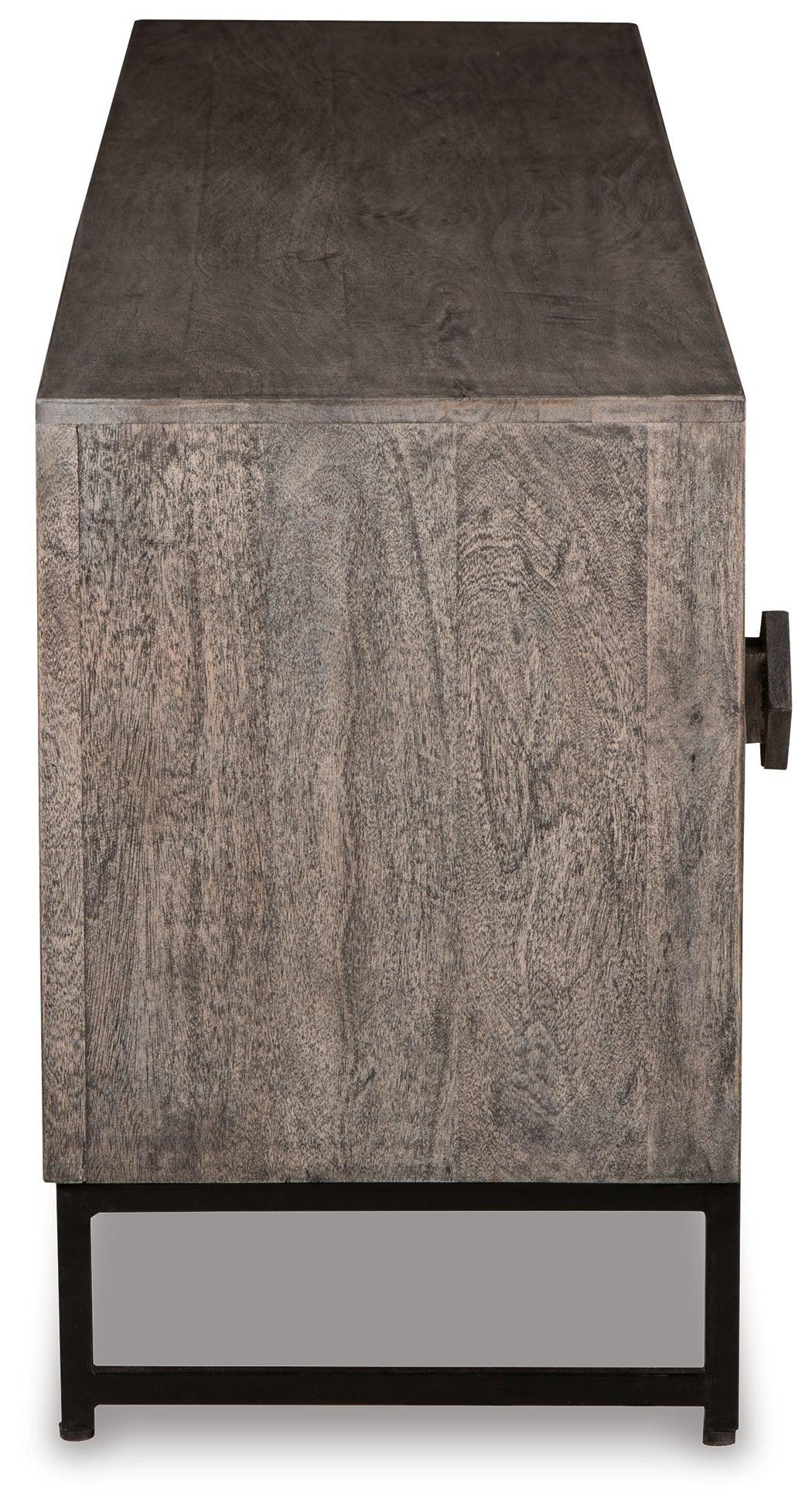 Side view of Treybrook Distressed Gray Accent Cabinet