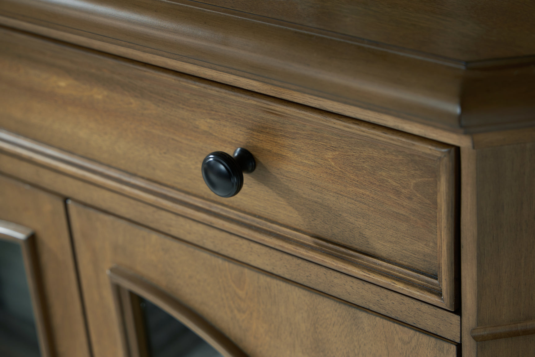 Close-up of metal door pulls on Barlomore Cabinet