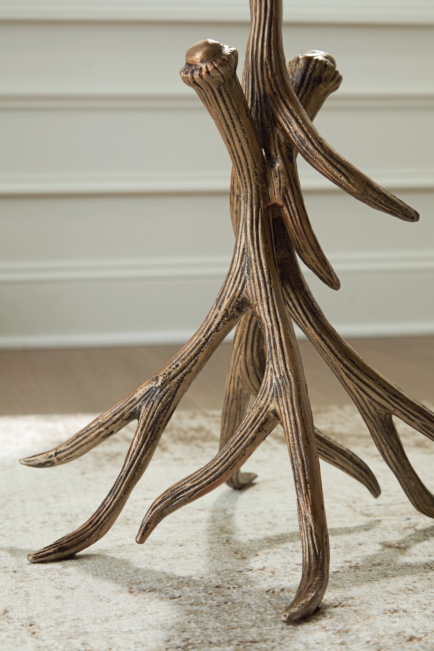 Detail of antique goldtone faux antler base