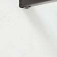 Finish close-up showing smooth black metal and marble surface