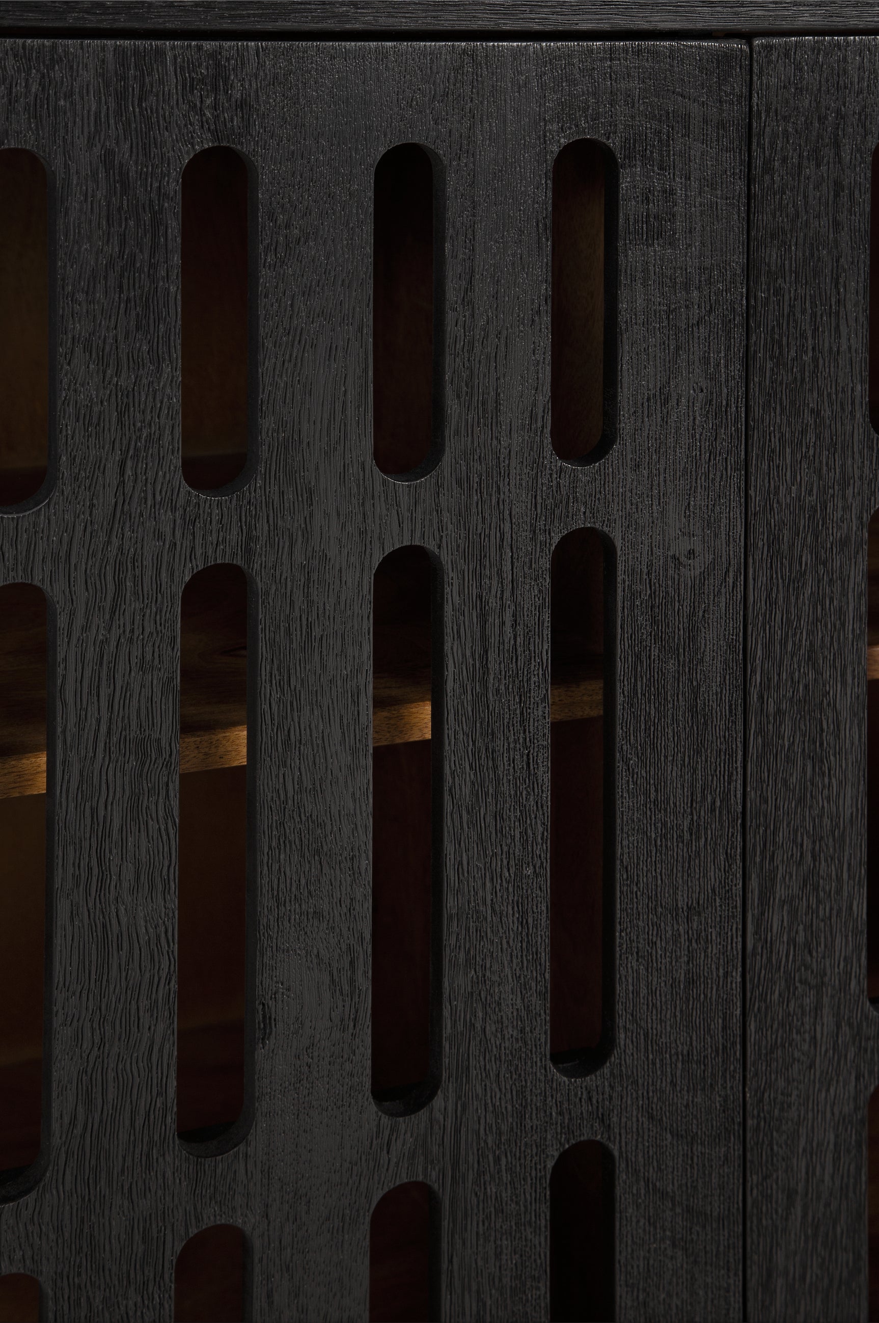 Detail of the black wire-brushed finish on the cabinet exterior