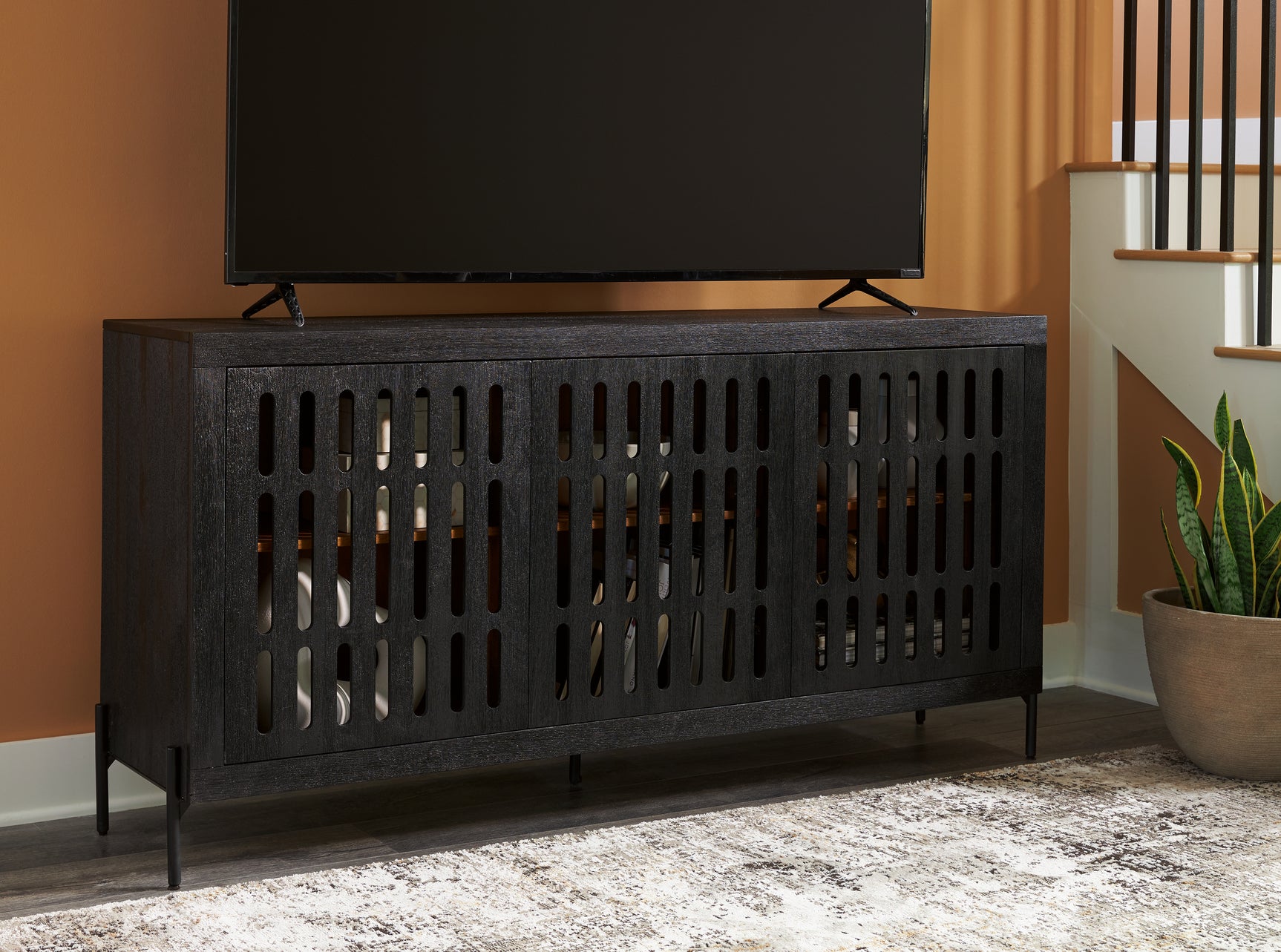 Vallisburg Accent Cabinet displaying electronic device cord openings