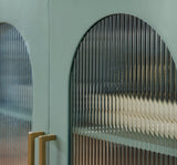 Close-up of goldtone metal door hardware on Adwen cabinet