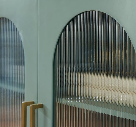 Close-up of goldtone metal door hardware on Adwen cabinet