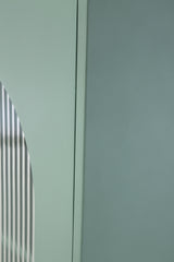 Detail of light green finish texture on Adwen cabinet