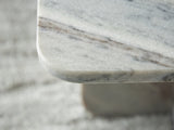 Profile shot highlighting marble texture of Baretton table
