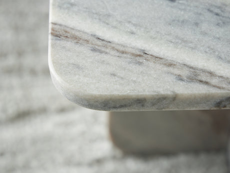 Profile shot highlighting marble texture of Baretton table