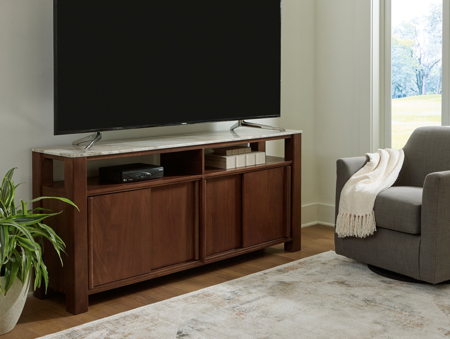 Tobinville accent cabinet shown as TV stand