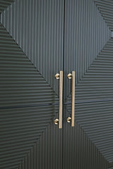 Close-up of Geirwood cabinet goldtone handle detail