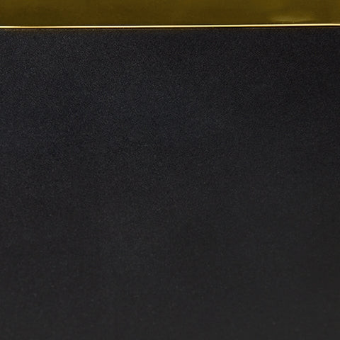 Close-up of gold-tone metal frame finish