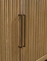 Close-up of antiqued goldtone metal door pull