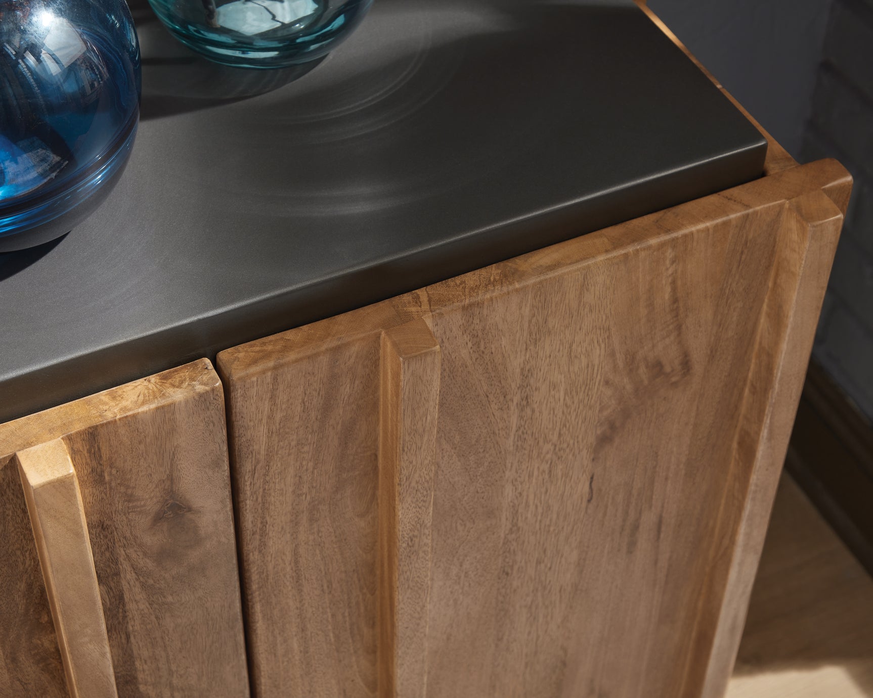 Close-up of charcoal gray top finish on cabinet