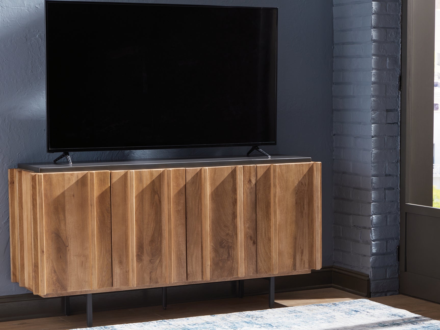 Quintavious Accent Cabinet with TV on top in living space