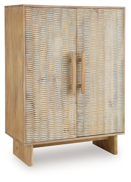Side angle of Dallinbury Accent Cabinet closed with carved door details